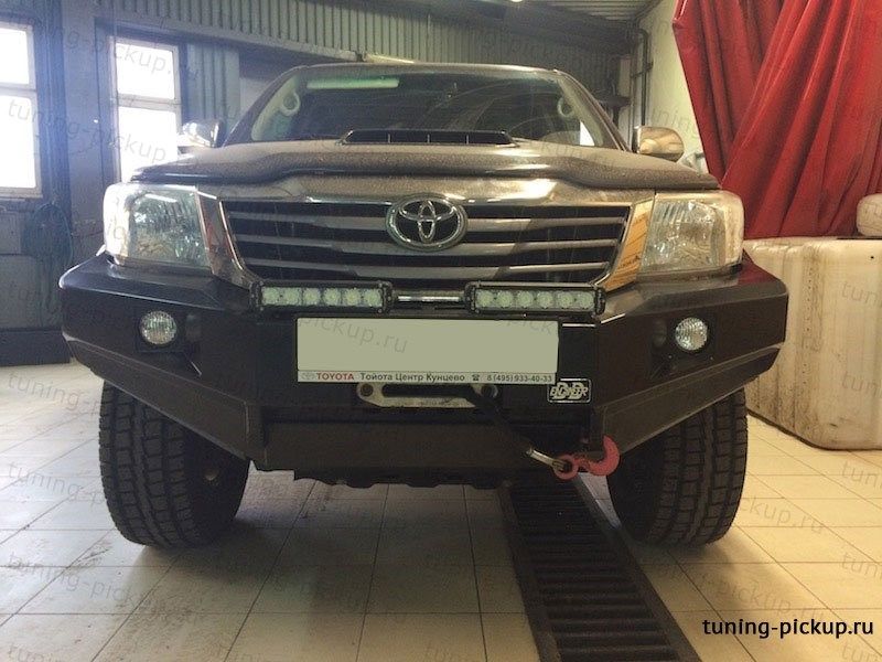 Бампер передний с площадкой под лебедку и доп. оптикой - Toyota Hilux 2011-2015 - Бампер передний